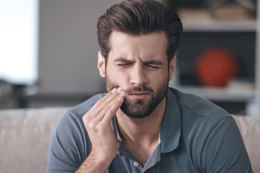 Frustrated young man with toothache
